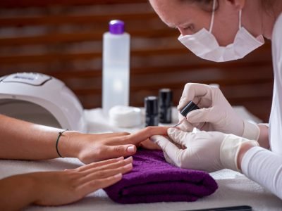 Cropped shot of a woman getting a manicure in the beauty salon